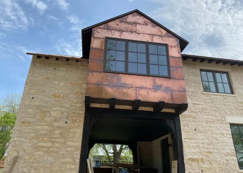 Copper metal panel facade on a stone building for Skylight Installation in Moraga