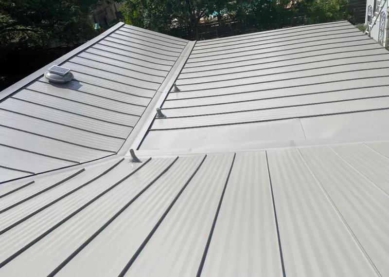 Solar attic fan installed on a metal roof for Roof Ventilation in Moraga